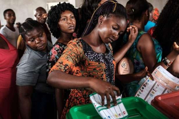 2022 06 29 woman casts ballot nigeria 1